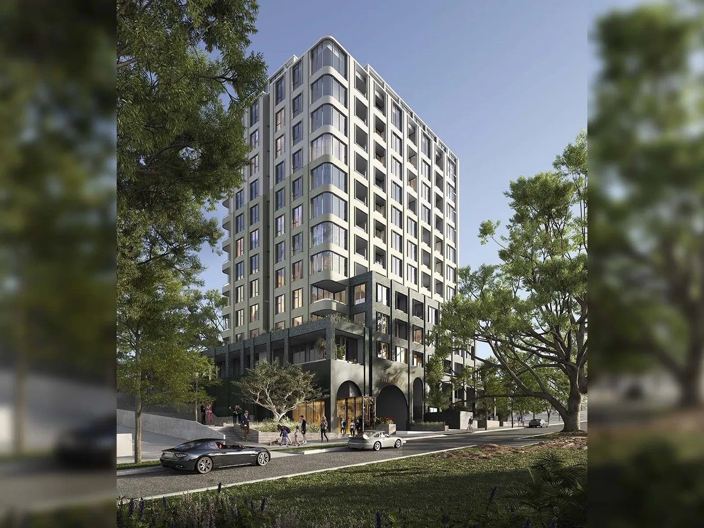 Modern apartment building with trees and street view.